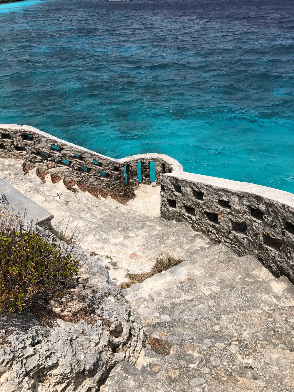 Stone stairs leading to the ocean.